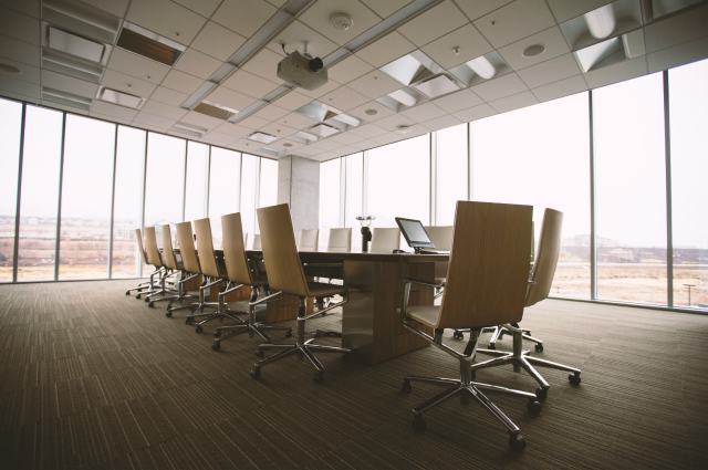 large office room with desk and chairs