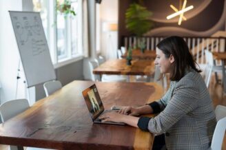 businesswoman sitting at desk with laptop