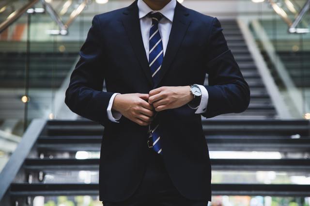 business man in suit and tie on stairs