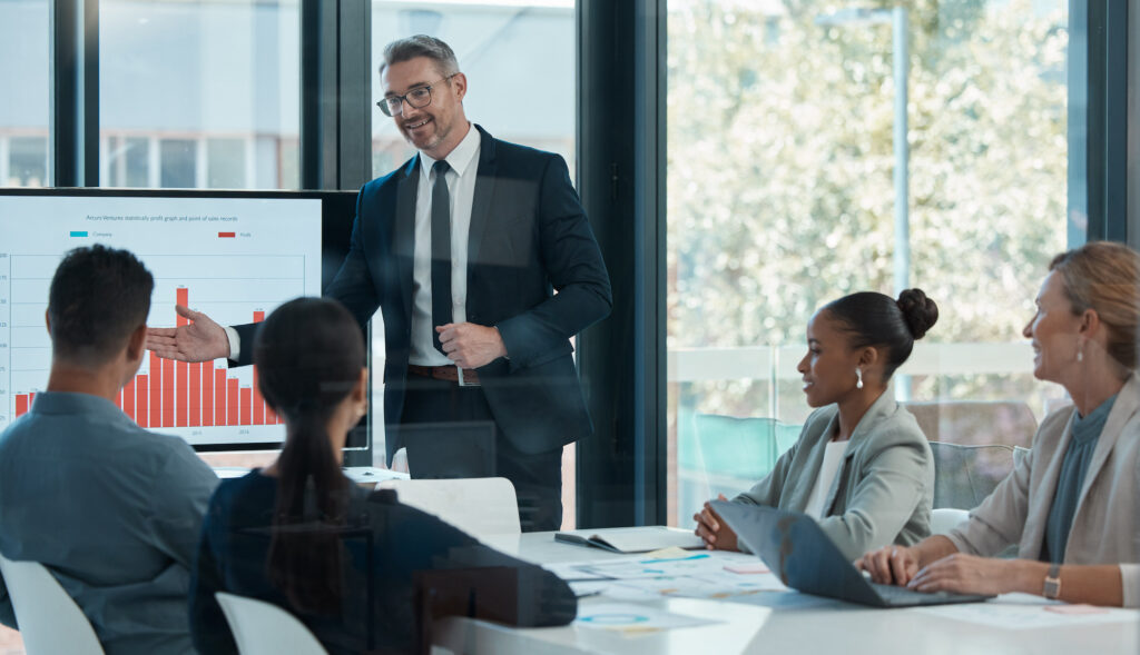 Businessman gives presentation to colleagues on top sales techniques