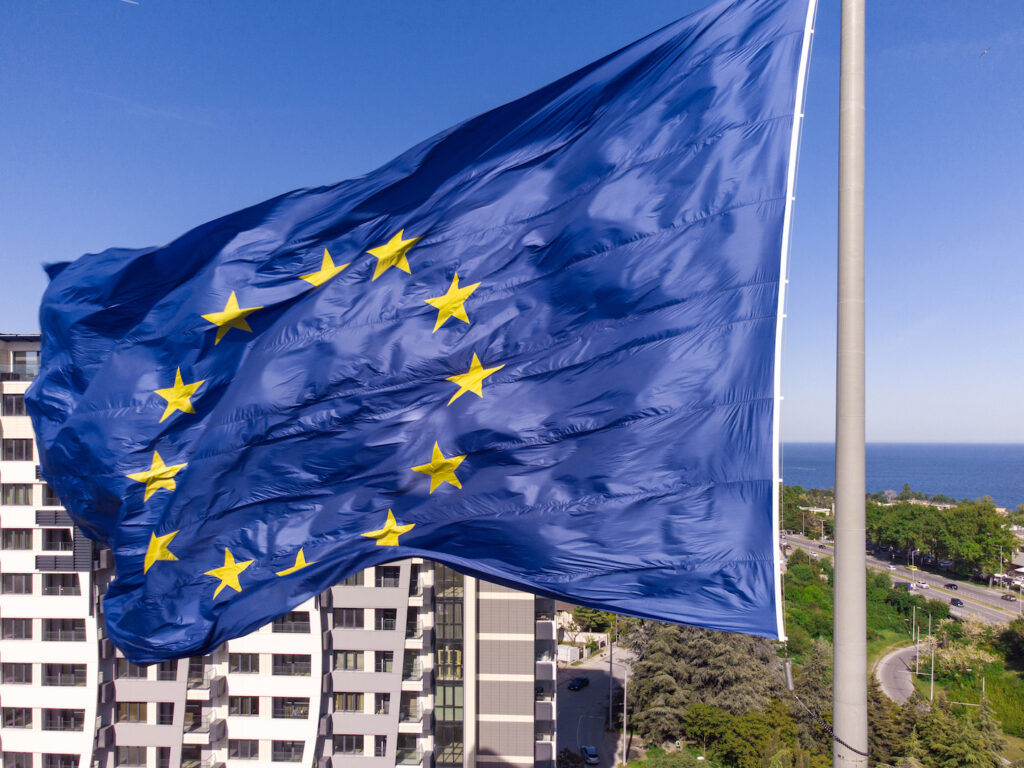 european union flag flies in the sky symbolizing GDPR requirements and data privacy laws